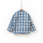 The House of Saffron Rajasthan Mist reversible cotton Kantha jacket with blue and white floral pattern, back view.