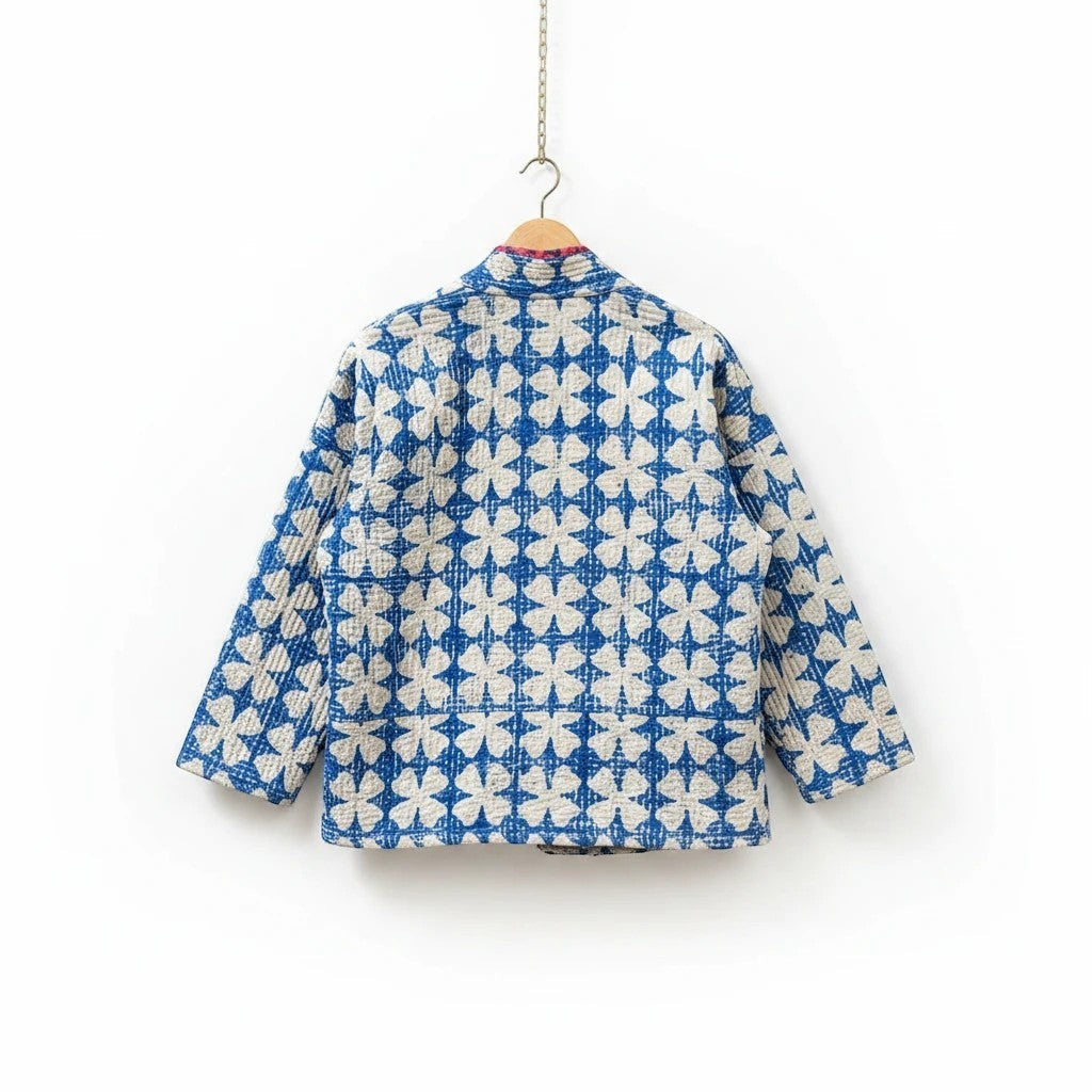 The House of Saffron Rajasthan Mist reversible cotton Kantha jacket with blue and white floral pattern, back view.