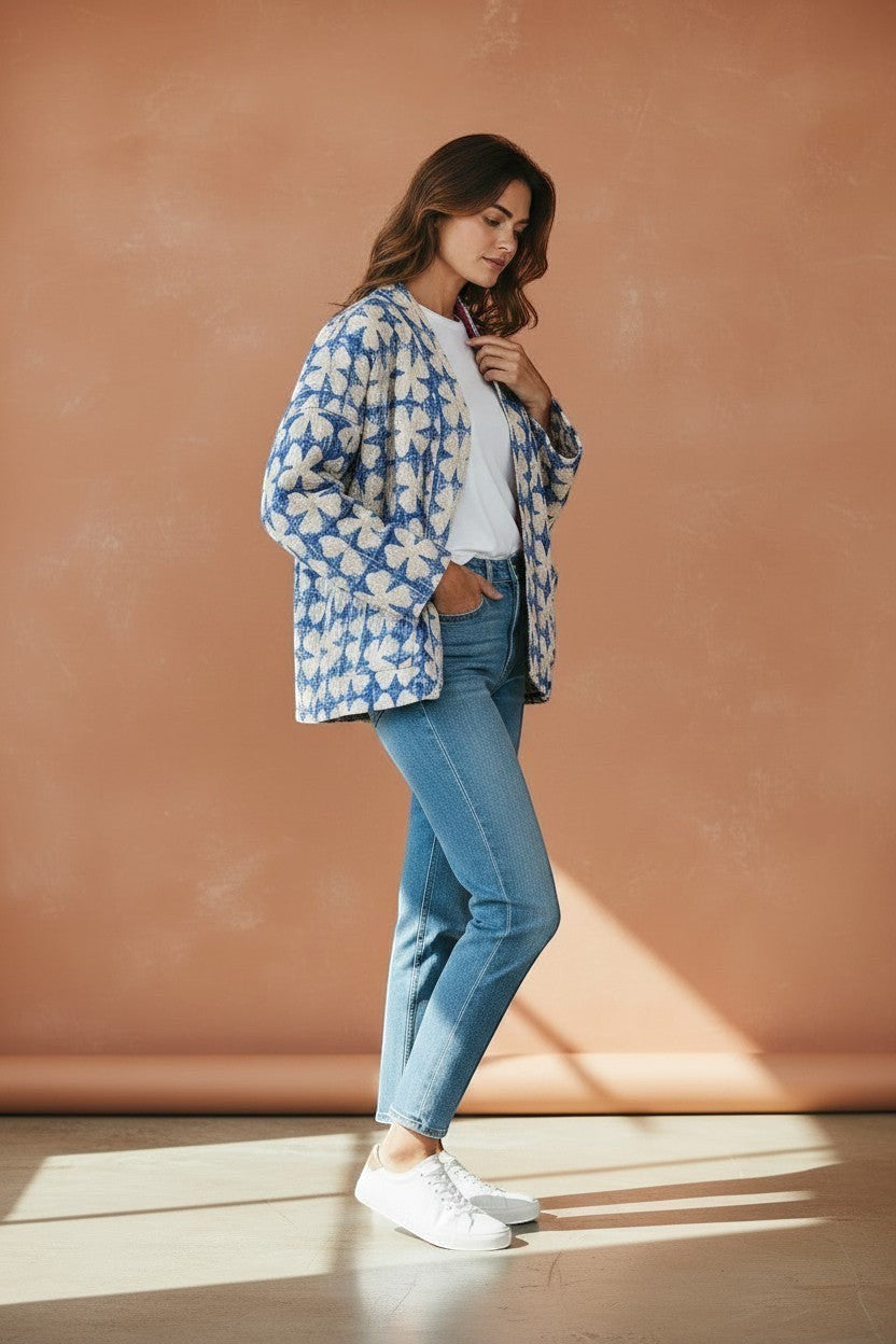 Model wearing The House of Saffron reversible blue and cream quilted cotton Kantha jacket with patch pockets