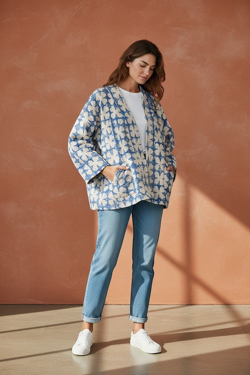 Model wearing The House of Saffron blue and white reversible quilted cotton Kantha jacket with patch pockets