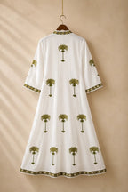 The House of Saffron white kaftan featuring olive green palm tree embroidery, V-neckline, and three-quarter sleeves.